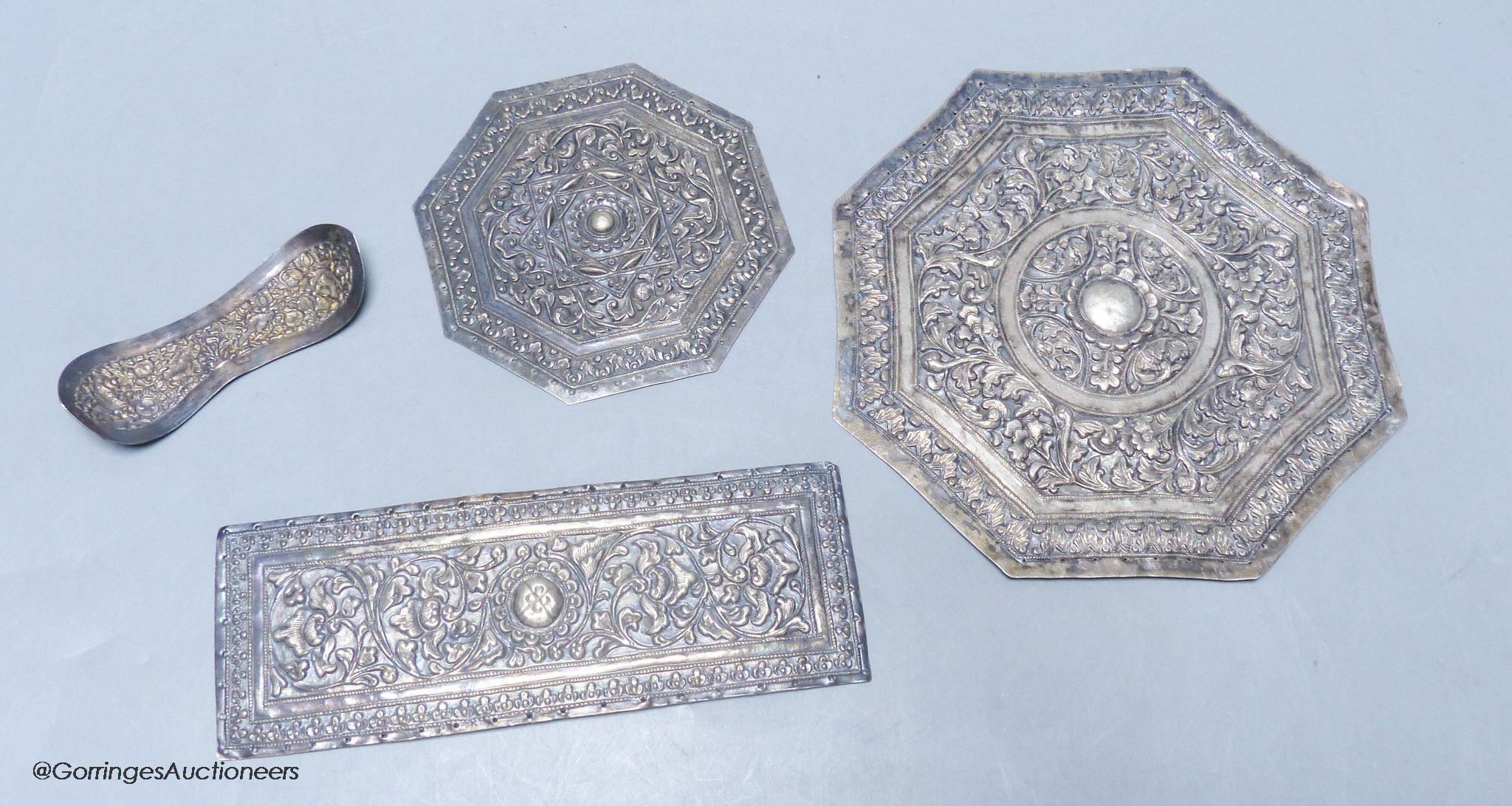 Three Malay Straits white metal 'buntal' or pillow ends